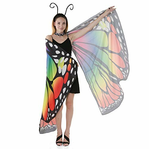 Woman wearing colorful butterfly wing costume with antenna headband.