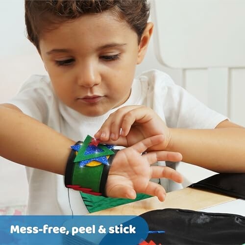 Child engaging in a craft activity with peel and stick materials.