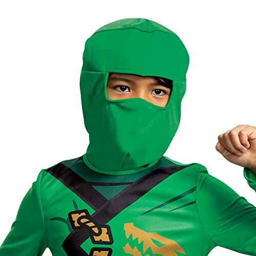 Child in a green ninja costume with a mask