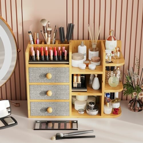 Bamboo bathroom organizer with drawers and shelves for toiletries.