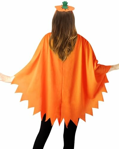 Person wearing an orange pumpkin costume with a cape and matching hat.