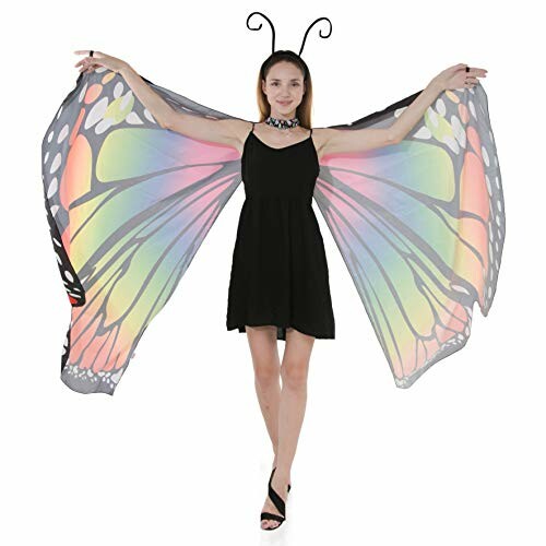 Woman wearing a butterfly wing costume with antenna headband.